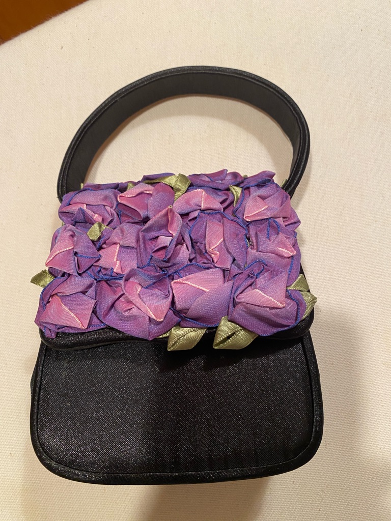 Black Satin Bag W/ Ribbon “ Violets” And Shoulder Strap. 6” X 5” X 2 1/2”.